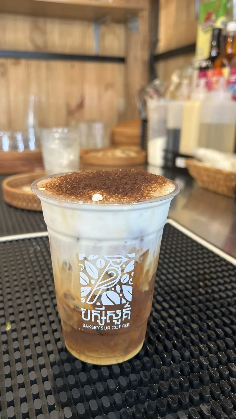 Iced coffee with a cocoa-dusted cream top